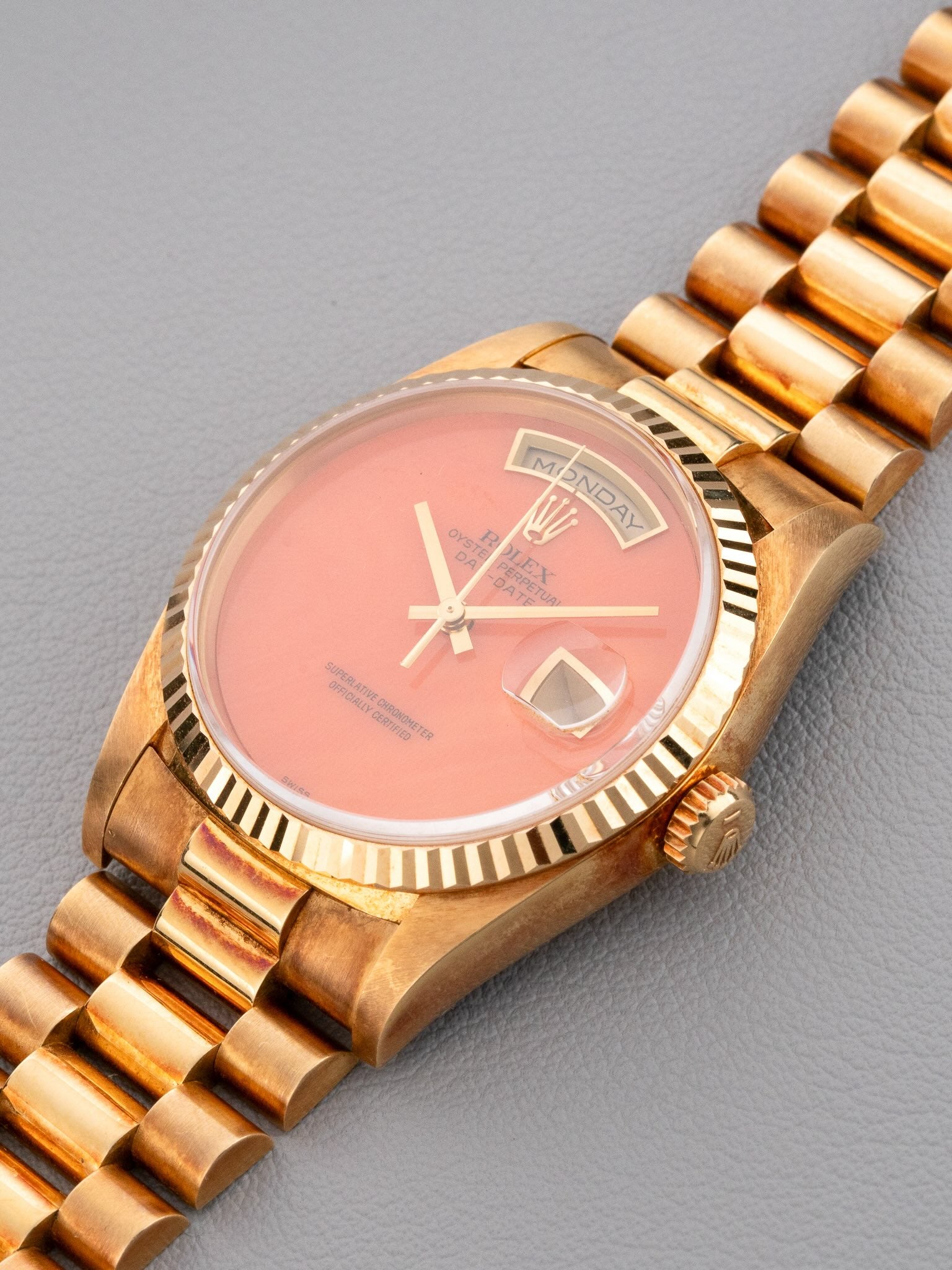 Sideview of Rolex Day-Date ref.18238 in Yellow Gold Coral dial