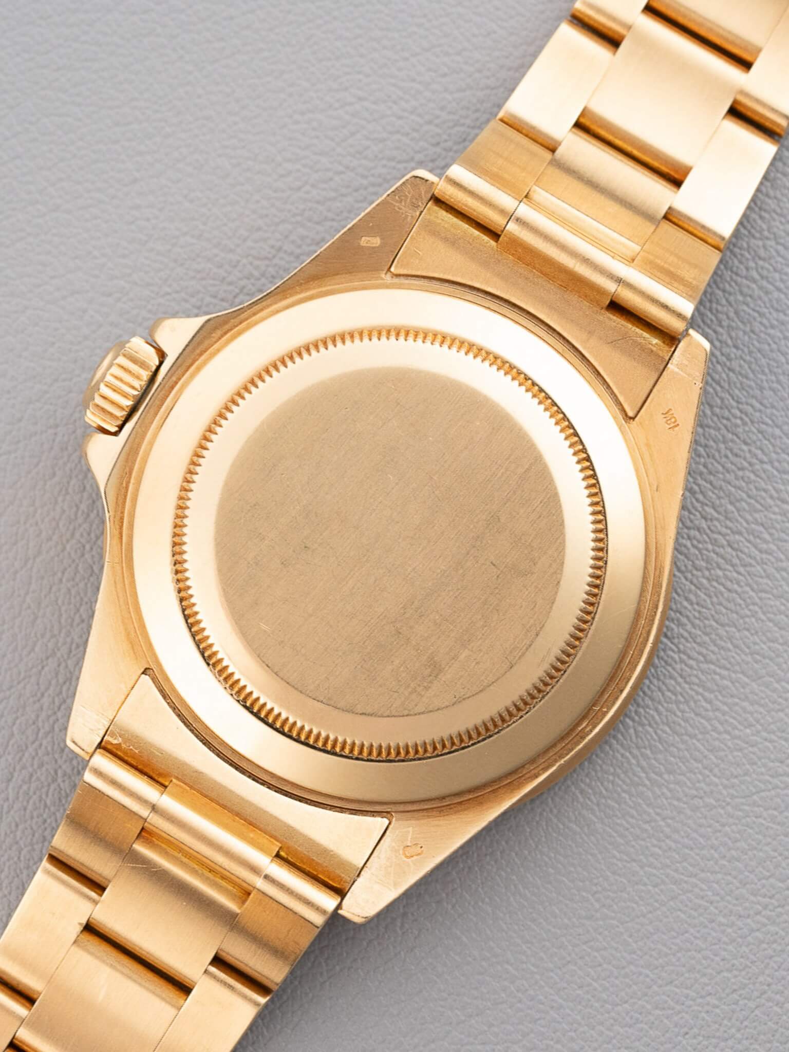 Case back of Rolex Submariner 16808 in Yellow Gold Tropical Dial